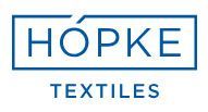 das logo für hopke textiles ist blau und weiß - Partner und Hersteller von Koke Raumausstattung - Tobias Liebrand - vor Ort in Senden und Lüdinghausen