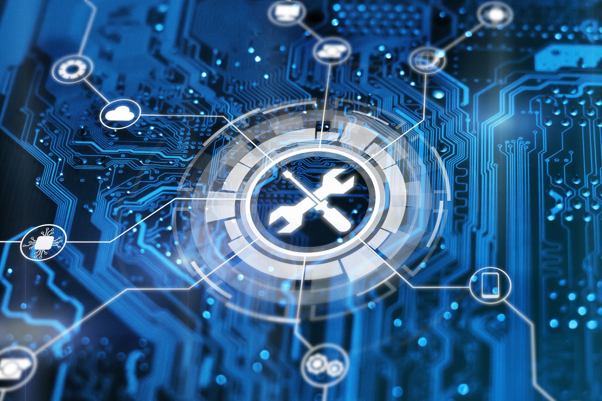 Carte de circuit imprimé avec superposition numérique d'une icône de clé à molette, représentant le support informatique.