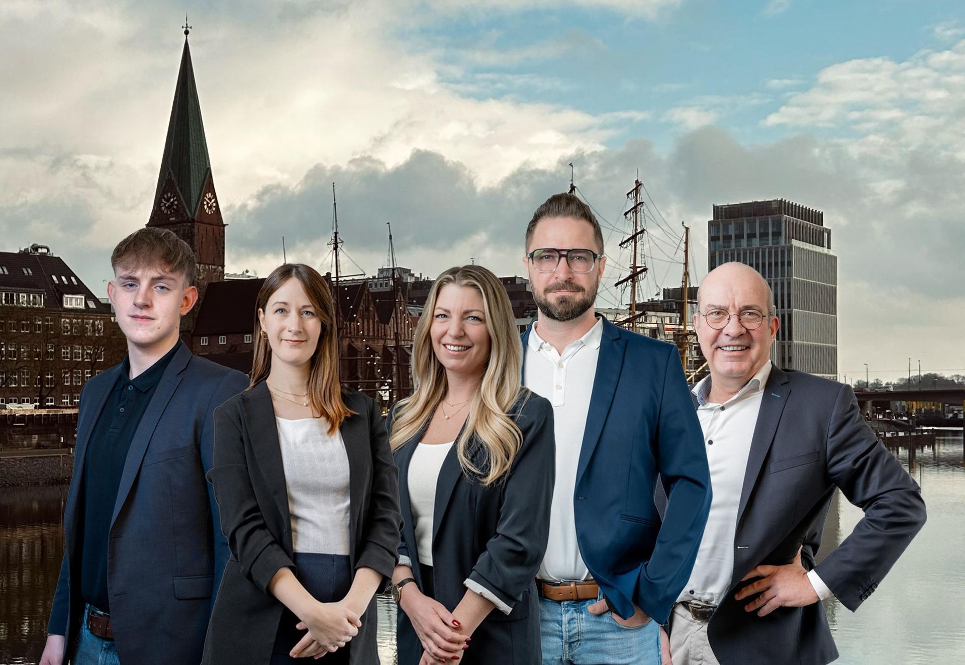 Eine Gruppe von Menschen steht nebeneinander vor der Skyline einer Stadt.
