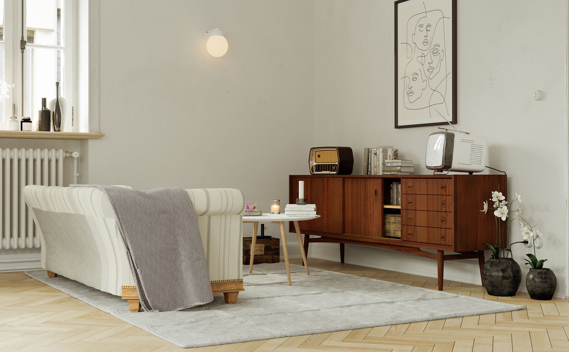 Salon avec canapé devant un meuble où sont posées une ancienne télévision et radio.