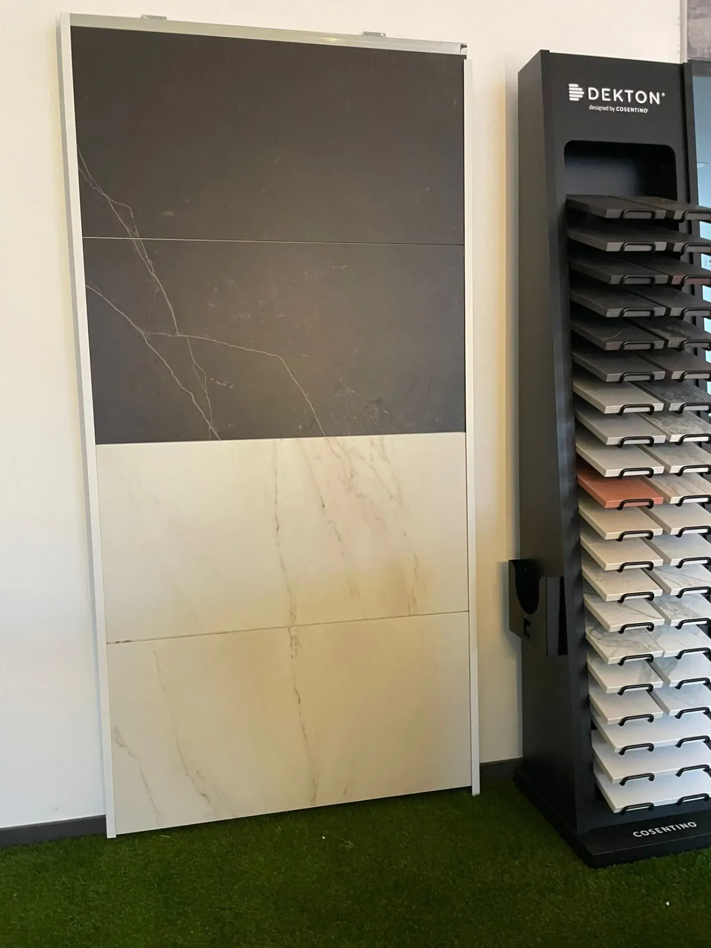 A display of tiles and a display of granite in a store.