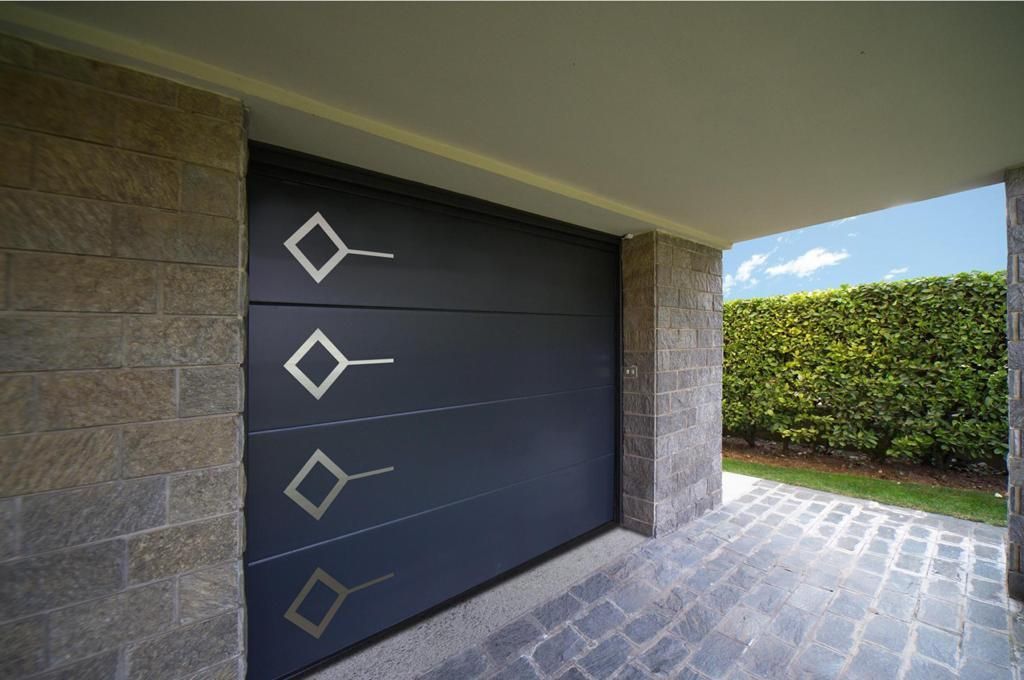 A black garage door with a geometric design on it
