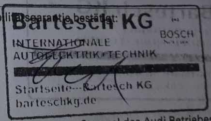 Ein schwarz-weißes Schild mit der Aufschrift „Internationale Autoelektrik Technik“