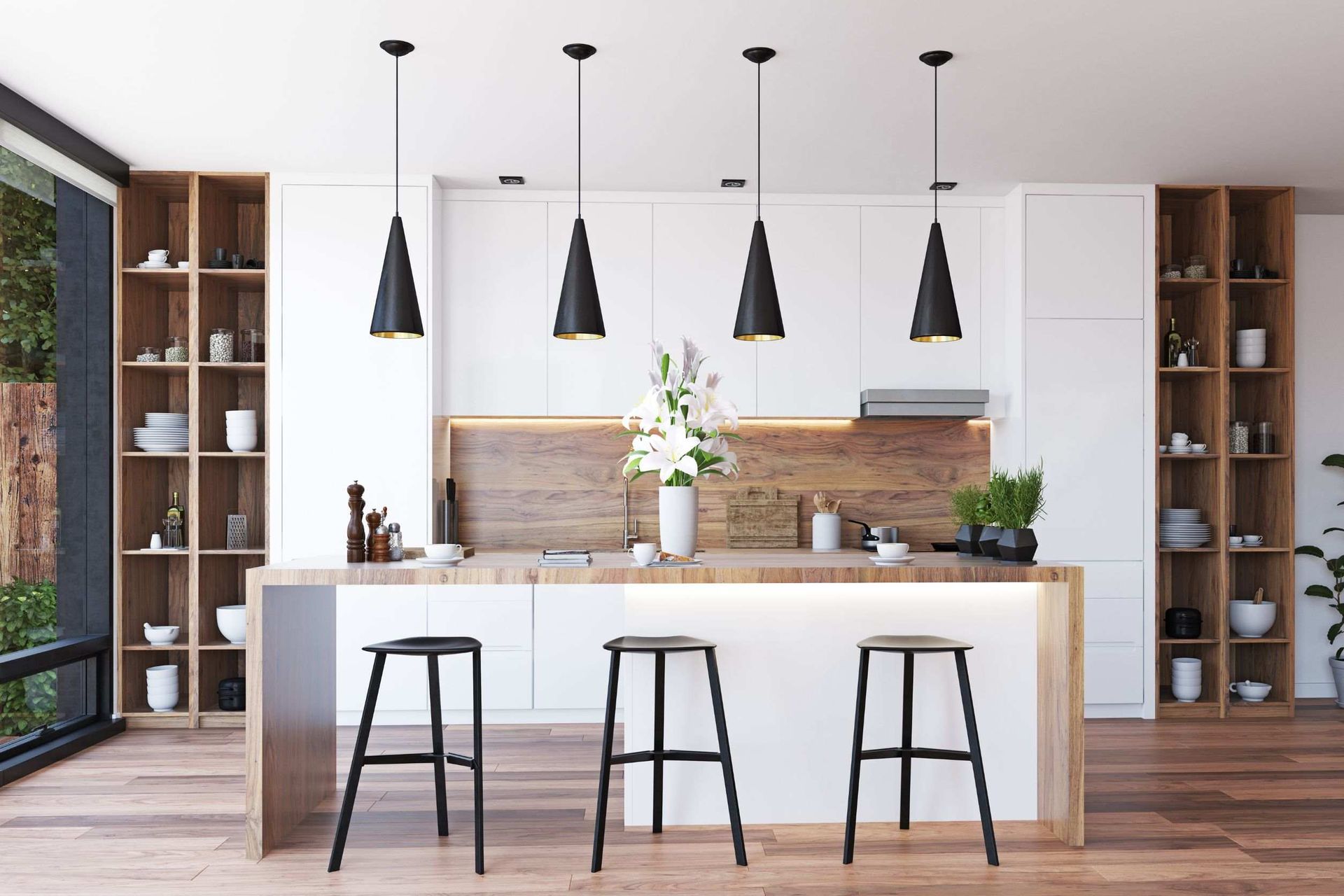 Una cocina con gabinetes blancos, encimeras de madera, taburetes y una gran isla.
