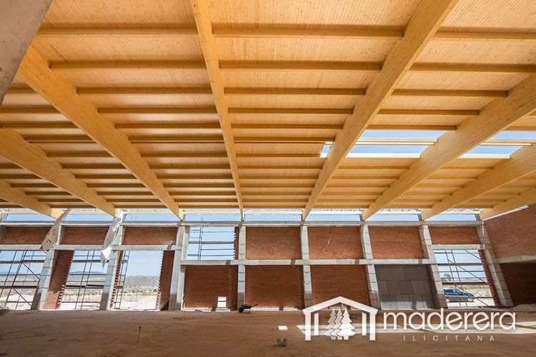 Un edificio en construcción con la palabra madera en la parte inferior.