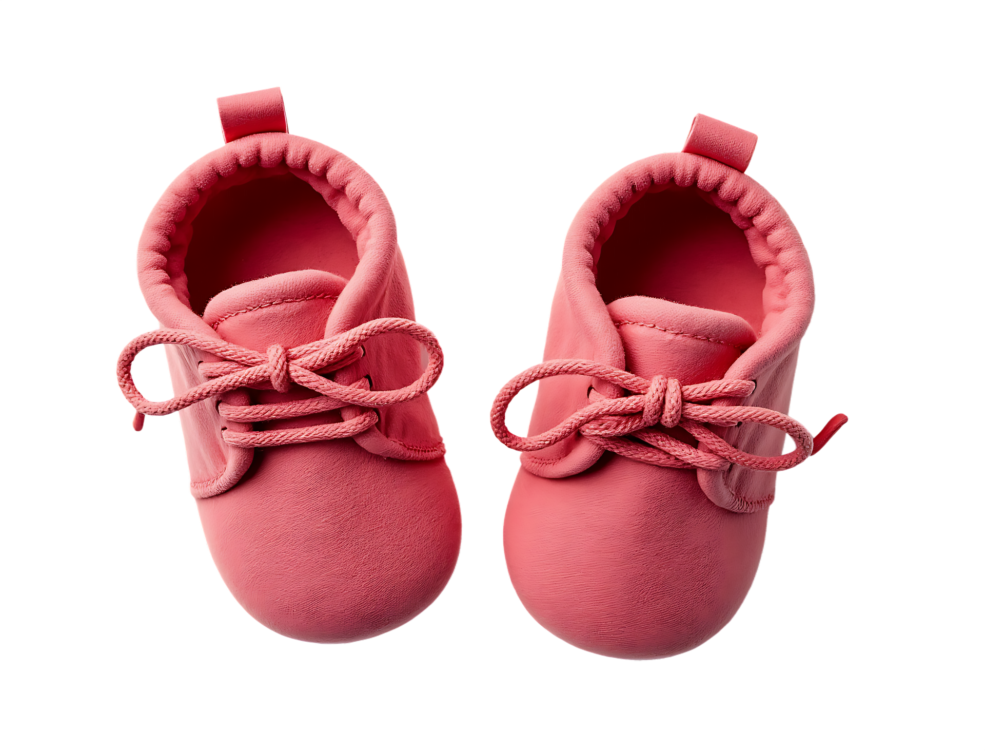 Paire de chaussons roses pour bébé avec des nœuds sur fond blanc