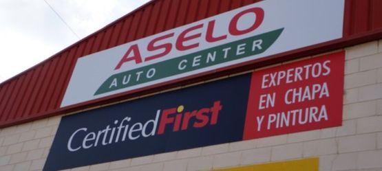 Un cartel que dice aselo auto center
