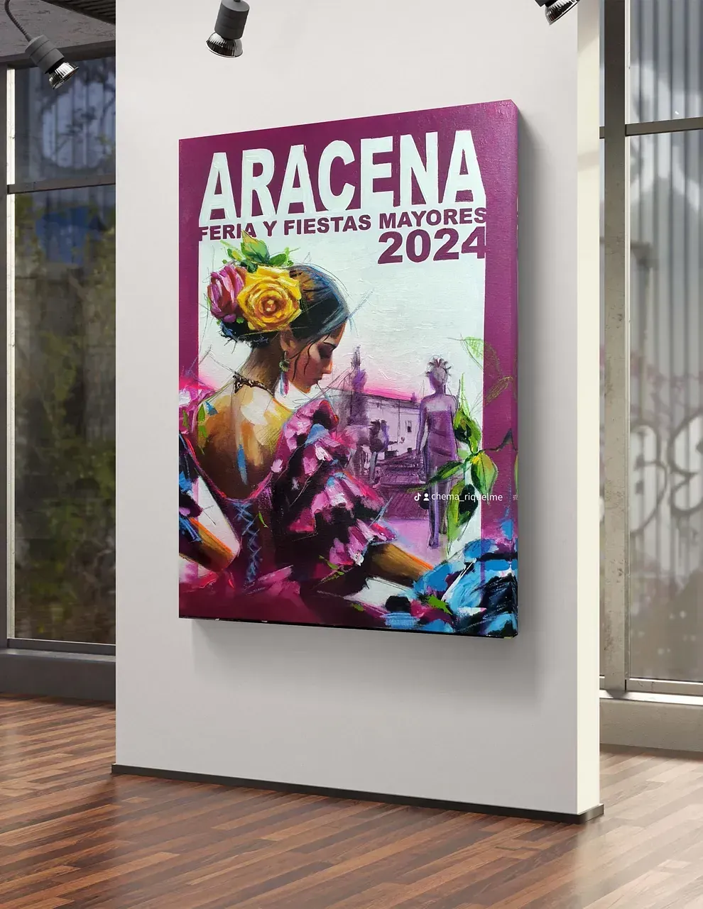 Un cuadro de una mujer con una flor en el pelo está colgado en una pared.