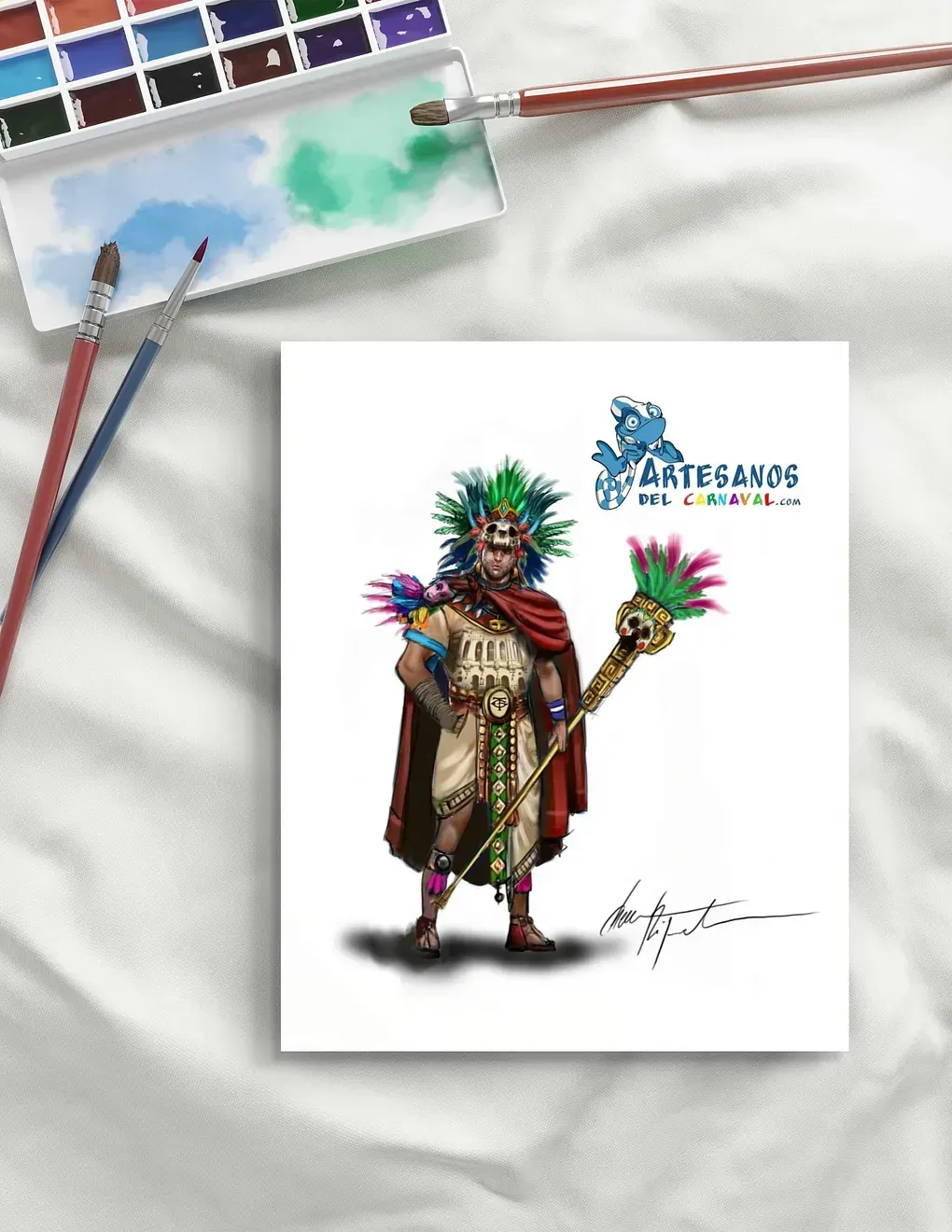 Una pintura de un nativo americano sosteniendo un bastón está sobre una mesa junto a acuarelas y pinceles.