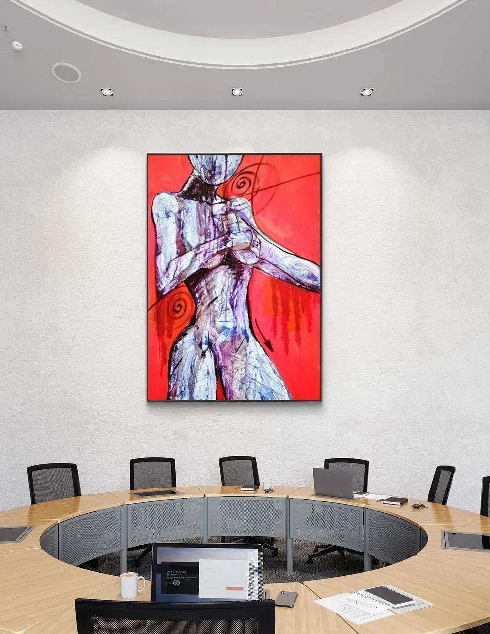 Una sala de conferencias con un gran cuadro en la pared.