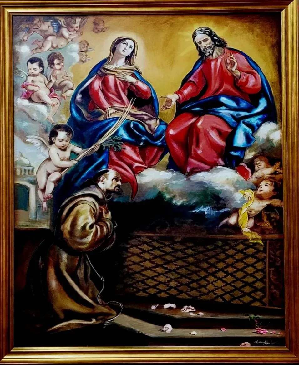 Un cuadro enmarcado de Jesús y María rodeados de ángeles.