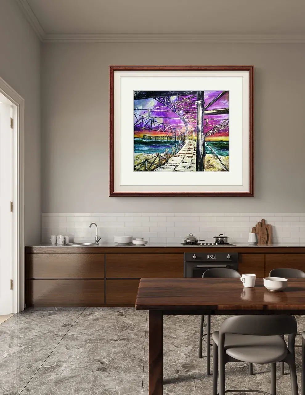 Una cocina con un cuadro en la pared encima de la mesa.