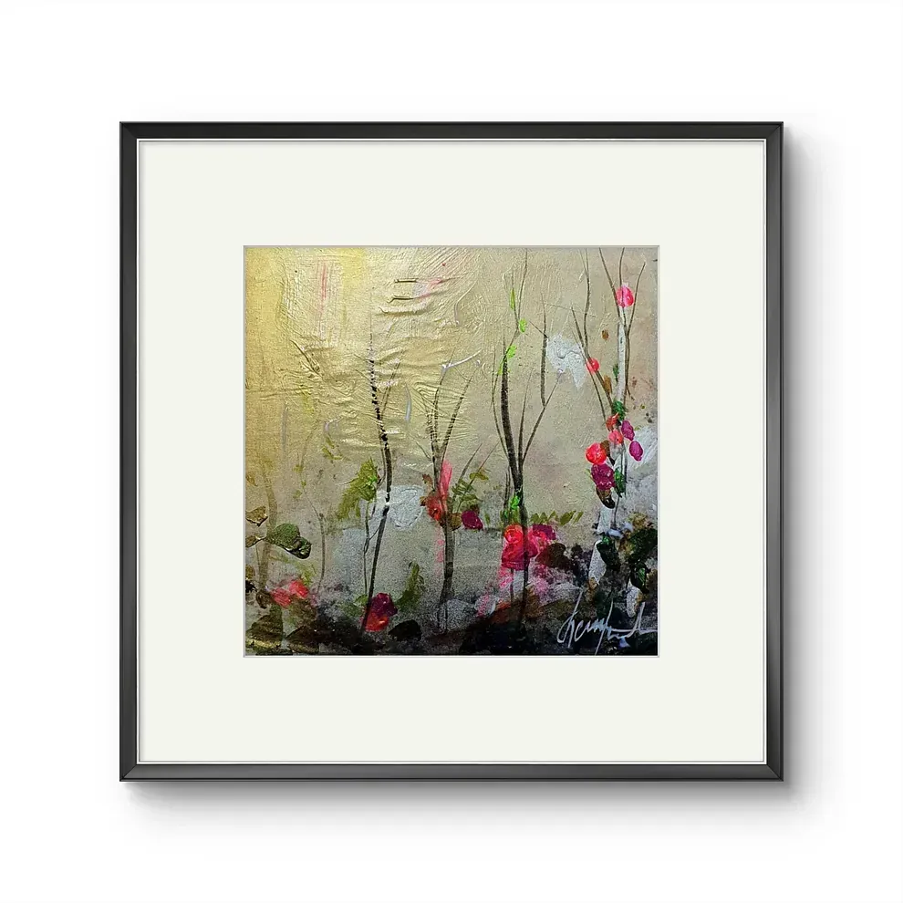 Un cuadro enmarcado de flores y árboles sobre un fondo blanco.