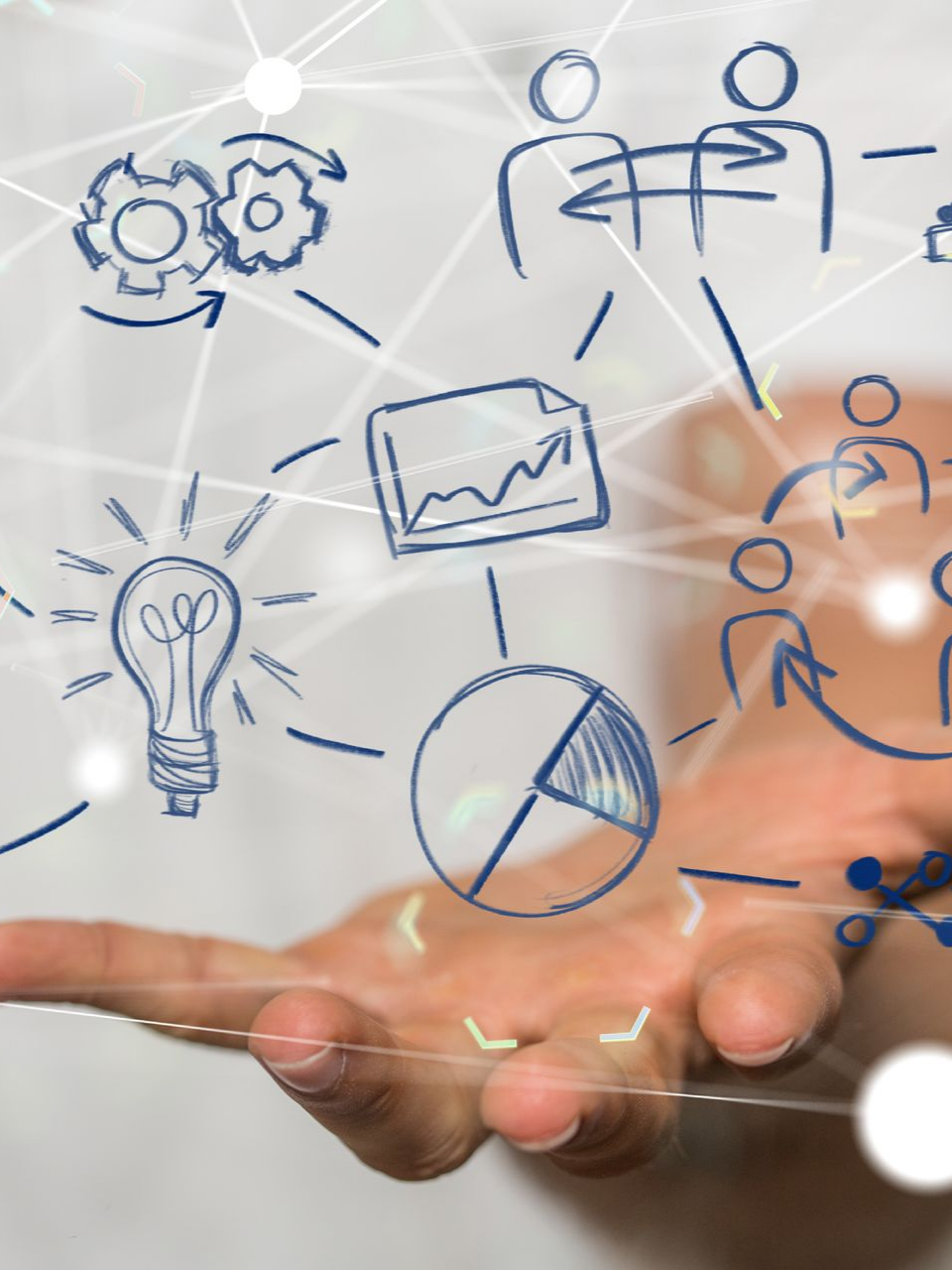 Main tenant un réseau de concepts commerciaux illustrés, comprenant des idées, des données et le travail d'équipe.