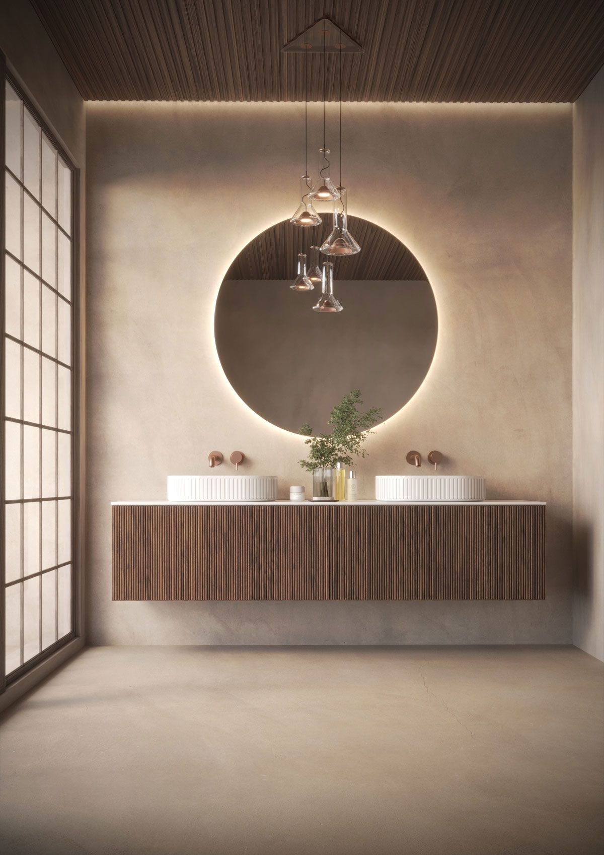 Baño moderno con tocador de madera, espejo redondo con luz y dos lavabos.