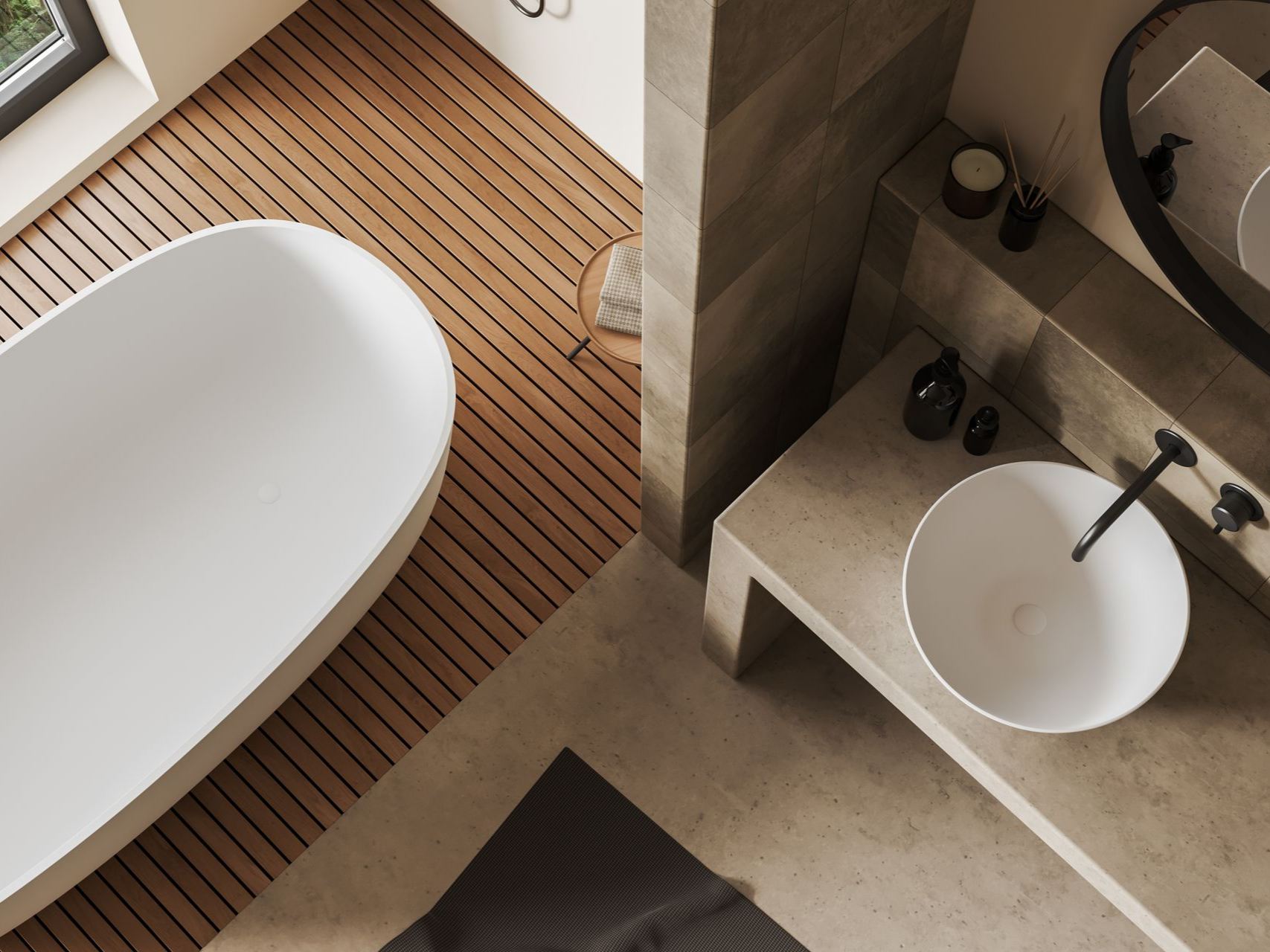 Salle de bains moderne avec baignoire ovale blanche, lavabo rond et parquet.