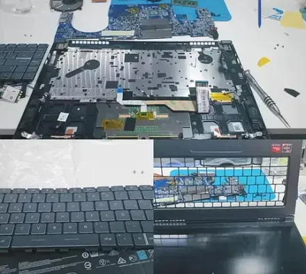 Se está reparando una computadora portátil sobre una mesa blanca