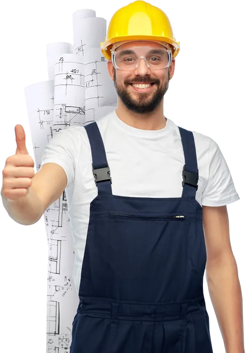 Un artisan portant un casque de chantier devant des plans