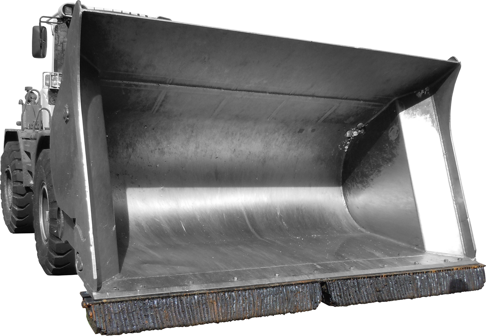 Engin de BTP de type chargeuse avec lames en caoutchouc