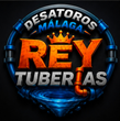 Logo circular de “Desatoros Málaga Rey Tuberías” con corona naranja y tubería azul sobre fondo negro