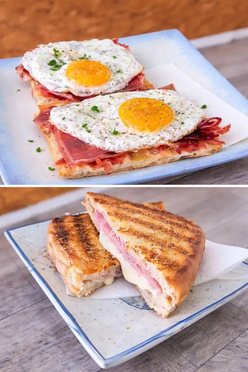 Dos sándwiches apilados, uno de ellos con huevos fritos encima, en un plato blanco al aire libre.
