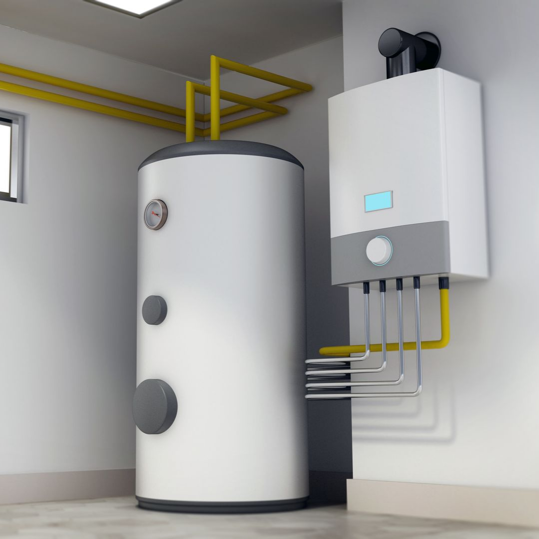 Un chauffe-eau et une chaudière fixés sur un mur blanc dans une buanderie ; des tuyaux jaunes.