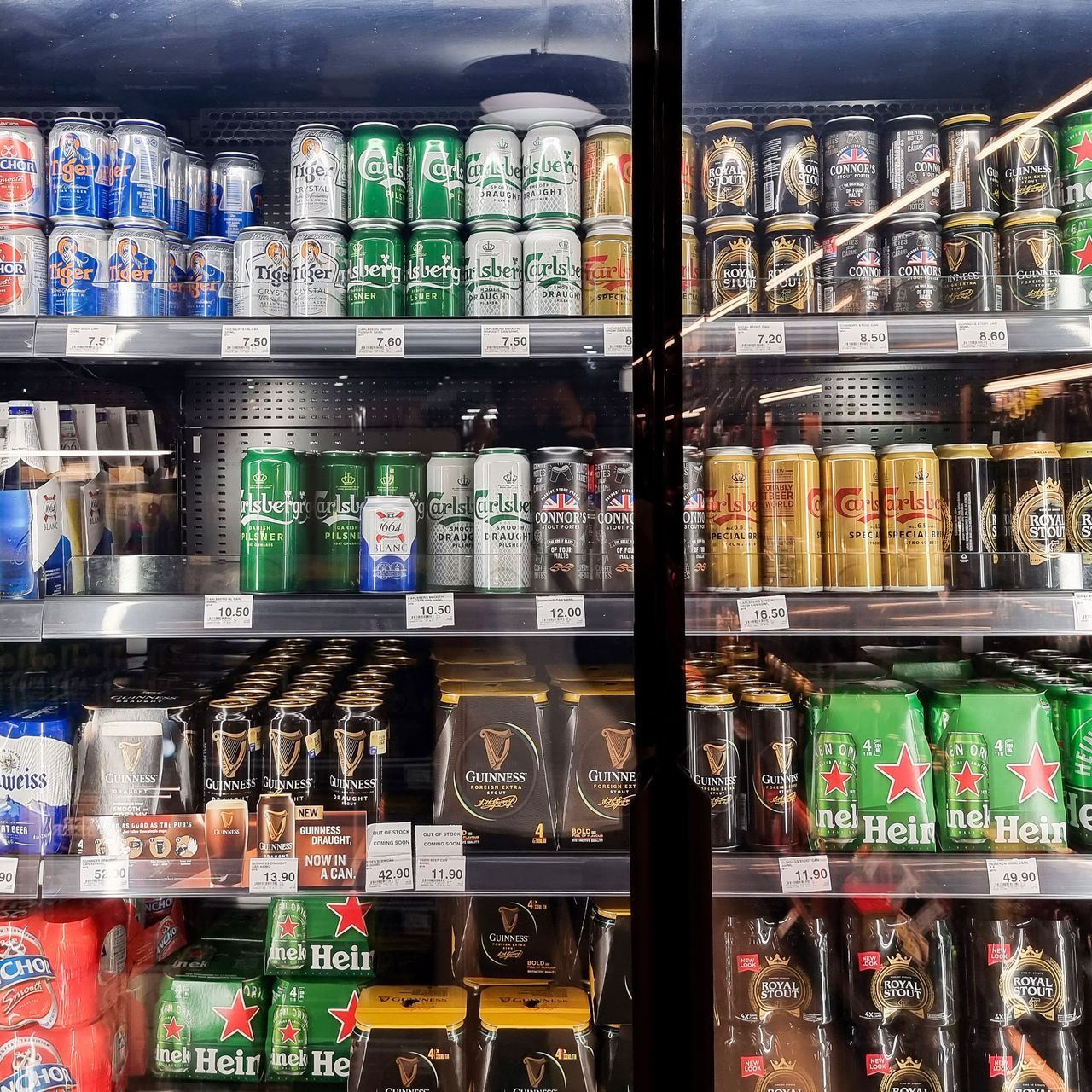 A refrigerator full of beer including heineken