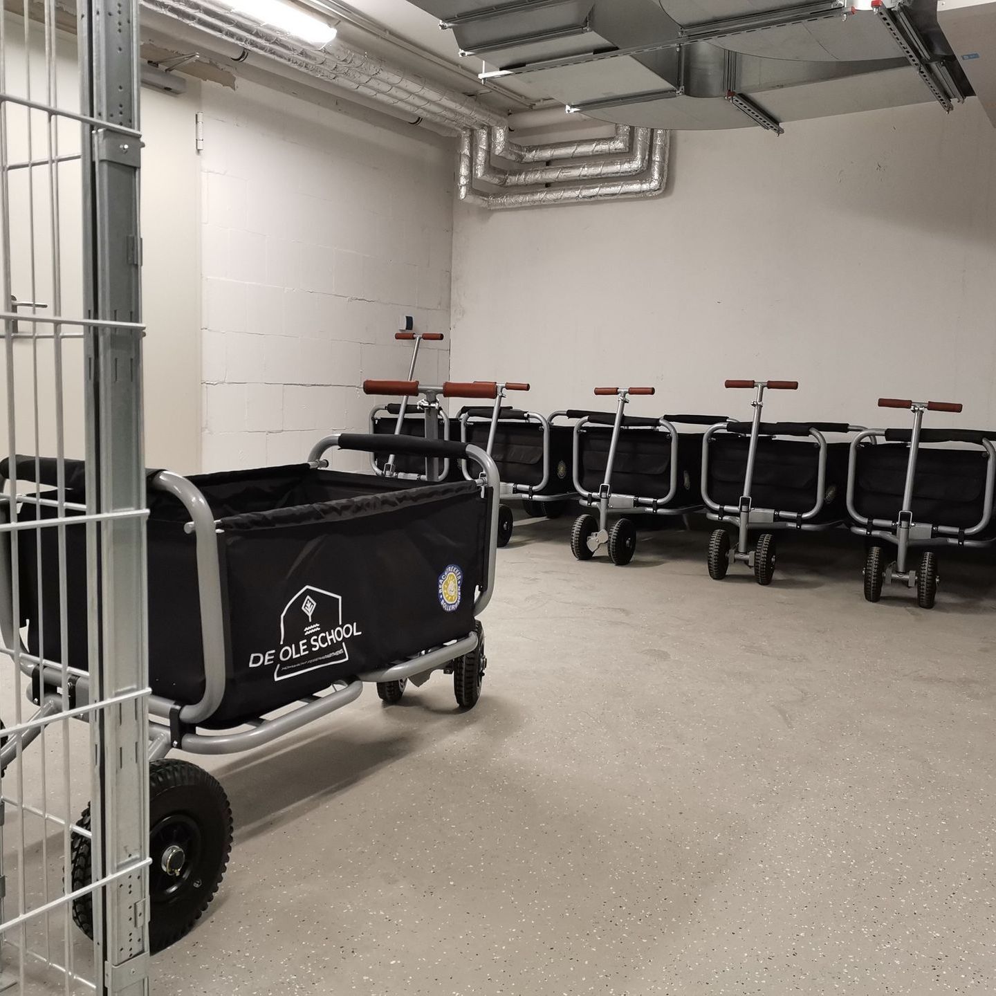 A row of wagons are lined up in a room