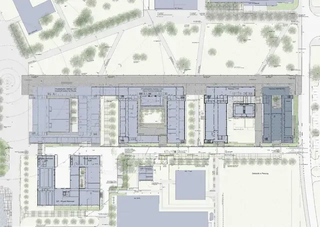 Ein Gebäude mit vielen Fenstern und Bäumen davor