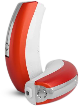 Une personne en blouse blanche et masque regarde au microscope dans un laboratoire, en train d'écrire.