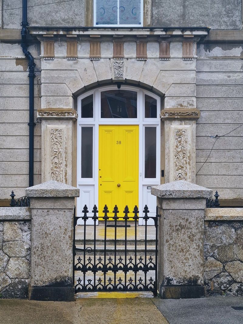 Yellow front door of a London townhouse