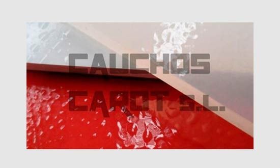 Un primer plano de una superficie roja con la palabra cauchos en ella.