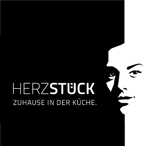 Black ad with white text “HERZSTÜCK – zuhause in der Küche” and a stylized face on the right