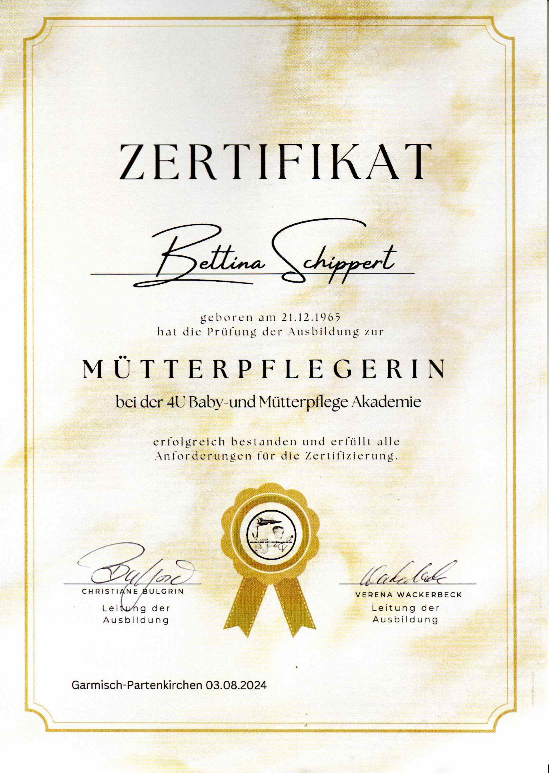 Eine Urkunde mit goldener Schleife und zwei Unterschriften darauf