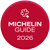 Een rood, rond logo met een wit Michelin-sleutelsymbool boven de tekst 