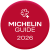 Een bordeauxrode cirkel met het witte Michelin-sleutellogo boven de tekst 