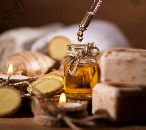 Réglage aromathérapie : compte-gouttes avec huile, gingembre, bougies, savon, serviette.