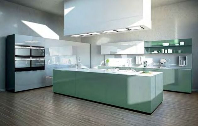 Cocina moderna con gabinetes verde menta, electrodomésticos de acero inoxidable y una brillante iluminación de tragaluz.