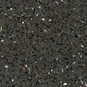 Primer plano de una superficie de piedra o terrazo gris oscuro moteada.