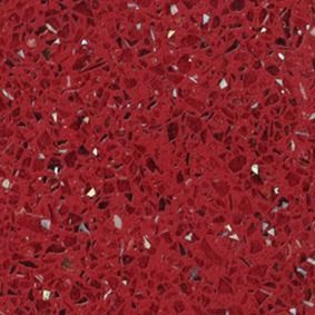 Primer plano de una superficie roja texturizada con pequeñas motas reflectantes.
