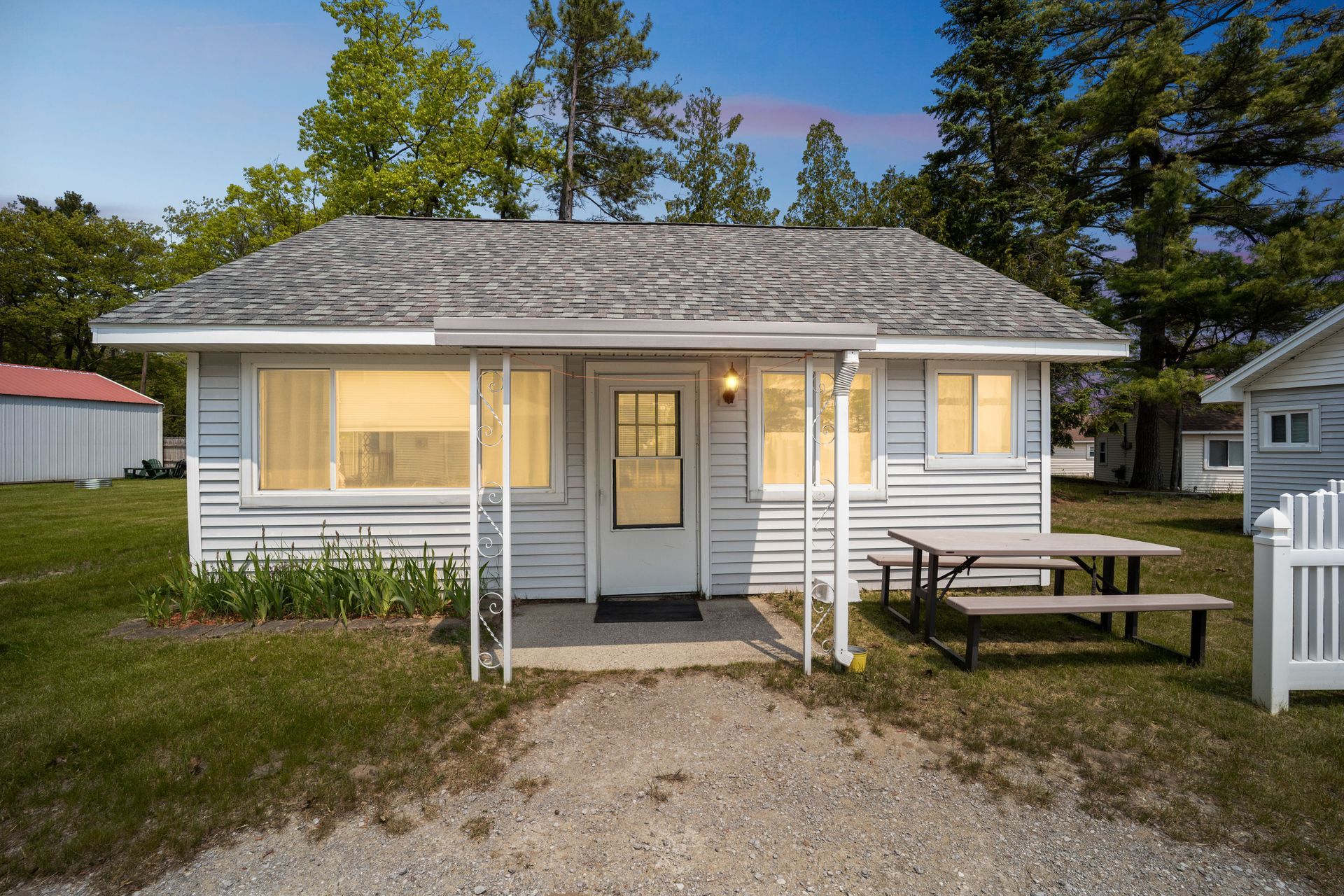 A living room with a recliner , couch , and kitchen.