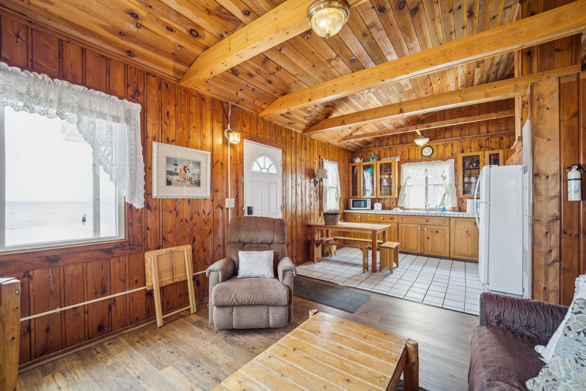A living room with a recliner and a table