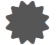 De color gris, puntiagudo y con forma de estrella.