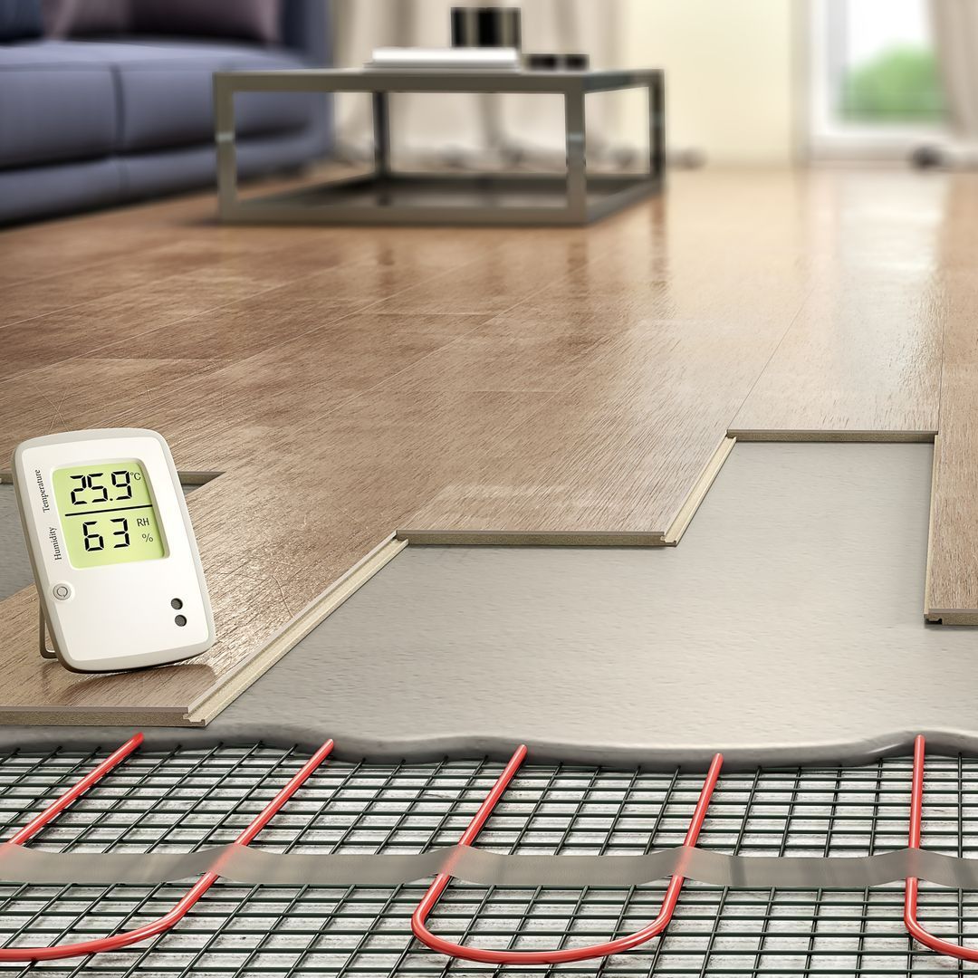 Photo d'un plancher chauffant et d'un thermomètre