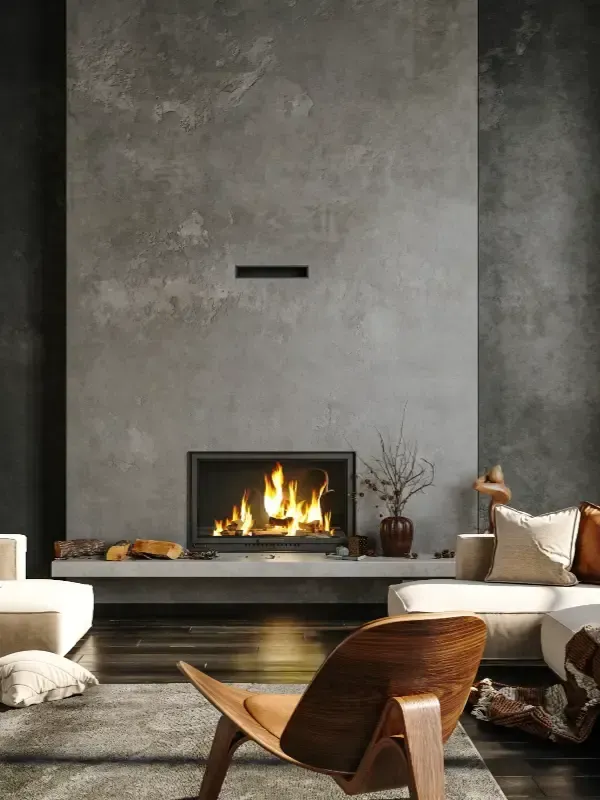 Salón moderno con chimenea de textura de piedra, fuego central, muebles minimalistas