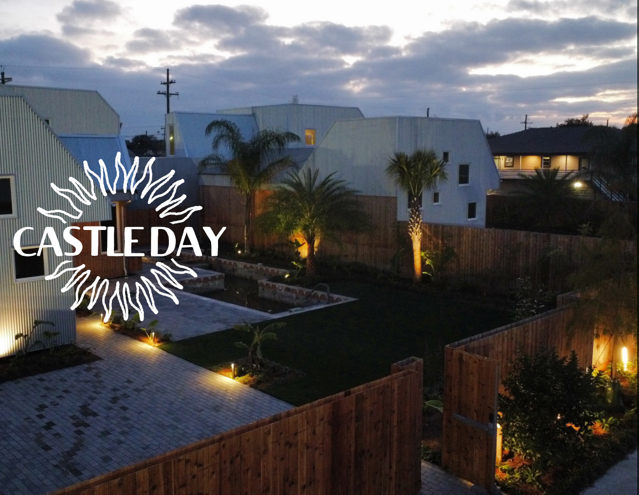 An aerial view of a castle day property at night