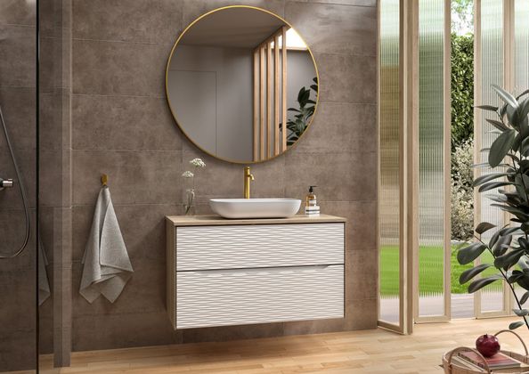 Meuble lavabo avec miroir rond.