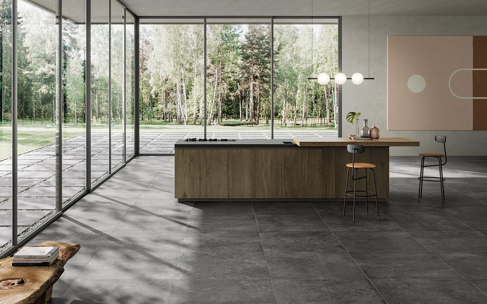 Cuisine moderne et minimaliste avec un grand îlot central, des baies vitrées et une vue sur le jardin.