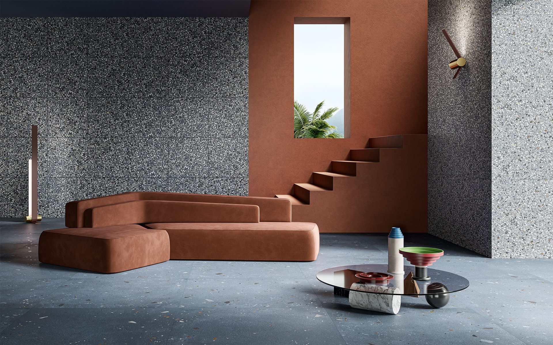 Salon avec canapé d'angle marron, murs mouchetés, escalier et table basse.