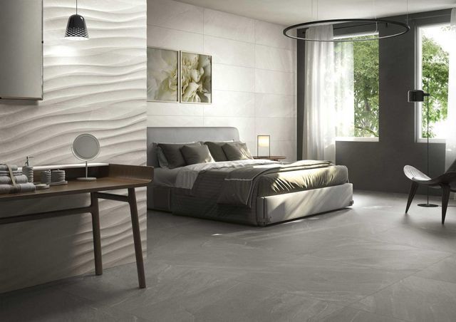 Chambre avec un carrelage mural en relief